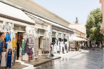 a street scene of a street with shops at Plaka's Hyatt in Athens
