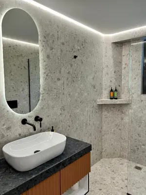 a bathroom with a sink and a mirror at Becool Apartment in Porto Rafti