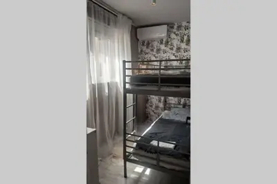 a small room with bunk beds in it at Luxurious apartment close to the beach and airport in Porto Rafti