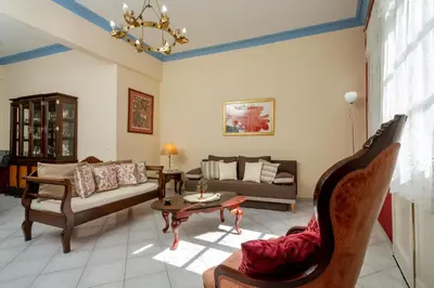 a living room with a couch and a table at ViLLA127 in Athens