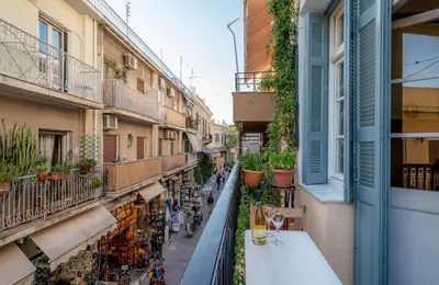a view of a street from a balcony of a building at ViLLA127 in Athens