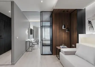a living room with a couch and a table at Ivis 4 Boutique Hotel in Athens