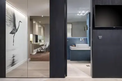 a bathroom with a bird on the glass door at Ivis 4 Boutique Hotel in Athens