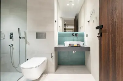 a bathroom with a toilet and a sink and a shower at Ivis 4 Boutique Hotel in Athens
