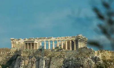 a building on top of a mountain at Ivis 4 Boutique Hotel in Athens