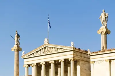 a building with a flag on top of it at Athens Stylish studio in front of Syntagma metro stop for 2 in Athens