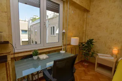 an office with a desk and a window at Athens Stylish studio in front of Syntagma metro stop for 2 in Athens