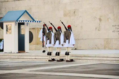 a group of soldiers standing in front of a wall at Athens Stylish studio in front of Syntagma metro stop for 2 in Athens