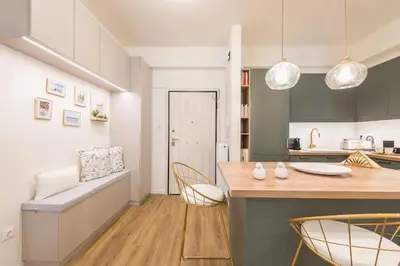 a kitchen with a table and chairs in a room at Chic and Comfort Home in Central Athens in Athens