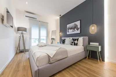 a bedroom with a large bed in a room at Chic and Comfort Home in Central Athens in Athens