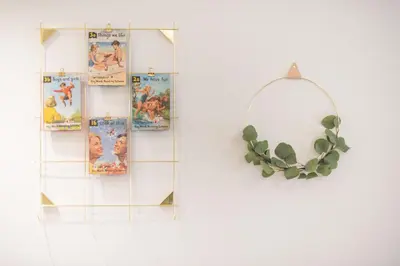 a round mirror with a plant on a wall at Chic and Comfort Home in Central Athens in Athens