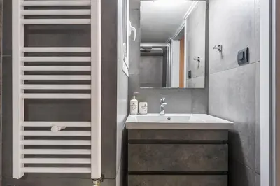 a bathroom with a sink and a mirror at Modern apartment Downtown Athens in Athens
