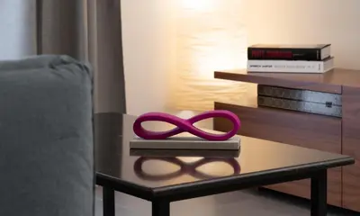 a table with a purple pair of scissors on it at Glyfada Gallery Apartment by First Class Properties in Athens
