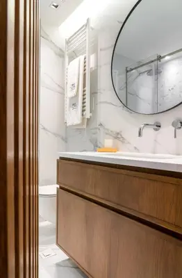 a bathroom with a sink and a mirror at Glyfada Gallery Apartment by First Class Properties in Athens