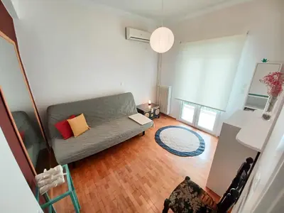an overhead view of a living room with a couch at Green tea balcony - quiet & cozy- Ano Glyfada in Athens