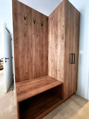 a wooden cabinet with birds on it in a room at Omega54 City Suites Athens Central Business District in Athens