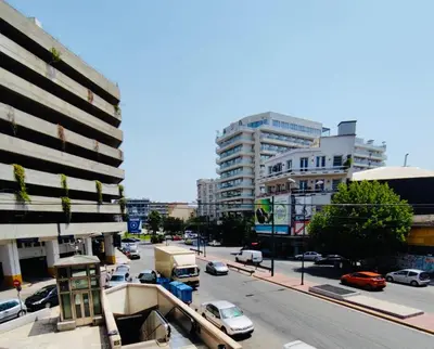 a view of a city street with cars and buildings at Omega54 City Suites Athens Central Business District in Athens