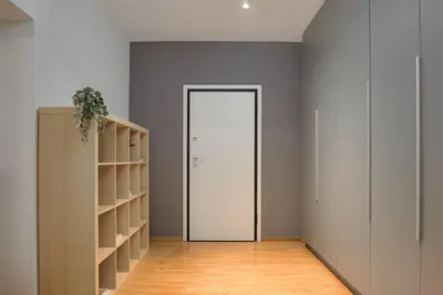 an empty room with a door and a shelf at Athenian Stylish Living in Athens