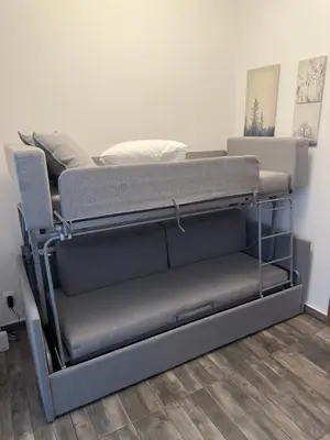 a bunk bed in a room with a bed frame at Olympic Hadrian Apartment next to Acropolis in Athens