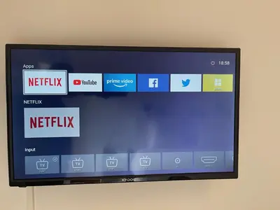 a television screen on a wall with different logos at Olympic Hadrian Apartment next to Acropolis in Athens