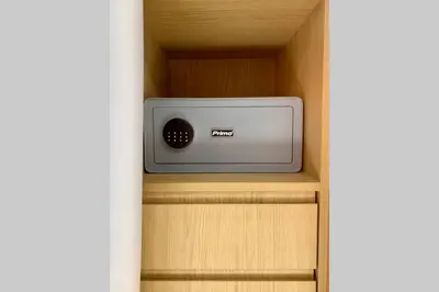 a small radio sitting on a shelf in a cabinet at Gray Studio in Athens