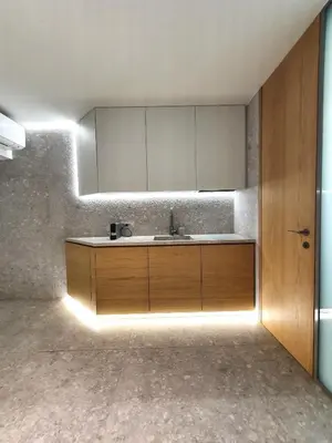 a bathroom with a sink and a mirror at Gray Studio in Athens