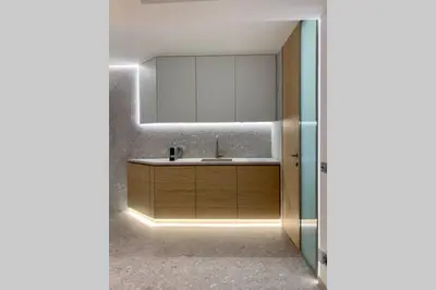 a bathroom with a sink and a mirror at Gray Studio in Athens