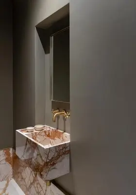 a bathroom with a marble sink and a mirror at Kinglin Luxury Living in Athens