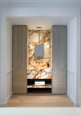 a dressing room with a stone wall and a television at Kinglin Luxury Living in Athens
