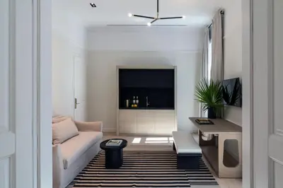 a living room with a couch and a table at Kinglin Luxury Living in Athens