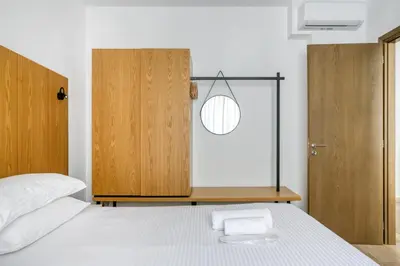 a bedroom with a bed and a glass door at Elia Kolonaki Luxury Apartments in Athens