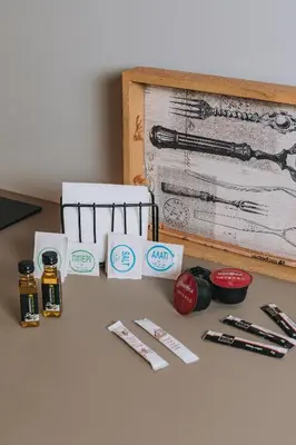 a table with pens and other office supplies on it at IVY Apartments in the Heart of Athens in Athens