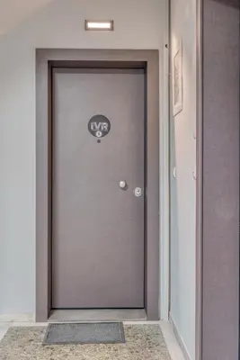 a gray door with a mph sign on it at IVY Apartments in the Heart of Athens in Athens