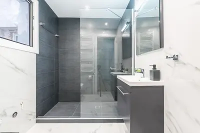 a bathroom with a shower and a sink at Athens Central Pangrati - Varnava Square Modern Apartment for 5 in Athens