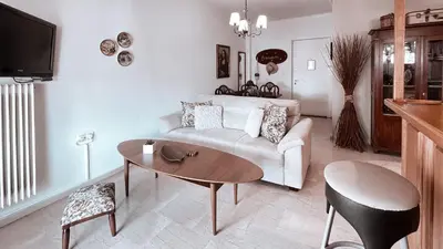 a living room with a couch and a table at IVY Muse 1BR Apartment in Neos Kosmos Athens in Athens