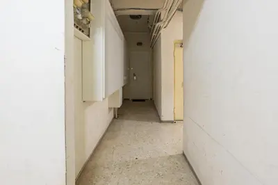 an empty hallway with a white wall and a door at Apartment at Megaro Mousikis st semi basement 1bed 2 pers by MPS in Athens