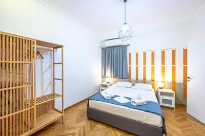 a bedroom with a bed in a room at Entire Apartment - Heart of Athens in Athens