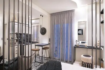 a room with a bar and stools in it at Adrianou at Heart of Plaka in Athens