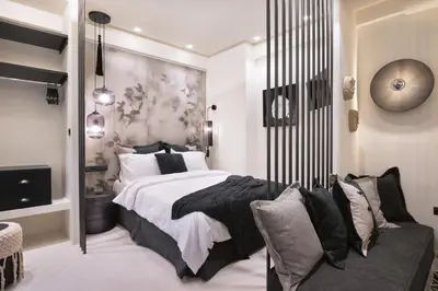 a bedroom with a large bed and a couch at Adrianou at Heart of Plaka in Athens