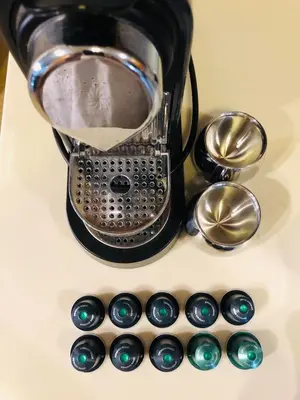 a coffee maker and some spoons on a counter at VILLA ELENI in Anavissos