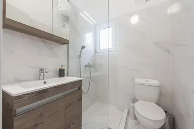 a bathroom with a toilet and a sink and a shower at ☆Acropolis View Villa☆Free Cancellation☆Rooftop Terrace☆ in Athens