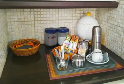 a kitchen counter with a tray of food and utensils at House Sleeps 4 with Pets in Kalívia Thorikoú