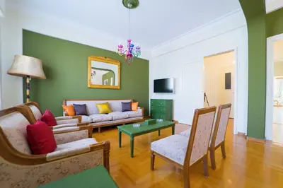 a living room with a couch and a table at Athens Colors Suite in Athens