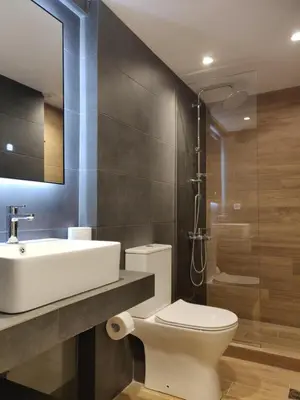 a bathroom with a toilet and a sink and a shower at Sunny lovely apartment 60 meters from the metro in Athens