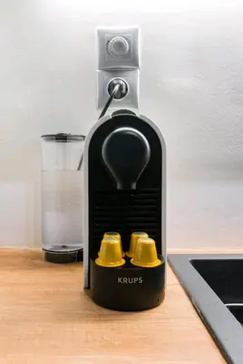 a black and yellow juicer sitting on a table at Explore a New Arts District from a Hip Studio Flat in Athens