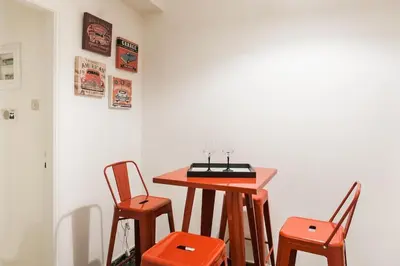 a table with two chairs and a table with a tableweredotent at Downtown Athens-Plaka Skoufou Apt/VaccinatedHost in Athens