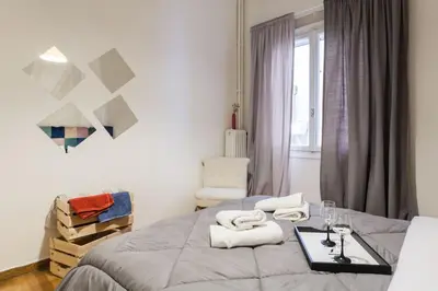 a bedroom with a bed with towels on it at Downtown Athens-Plaka Skoufou Apt/VaccinatedHost in Athens