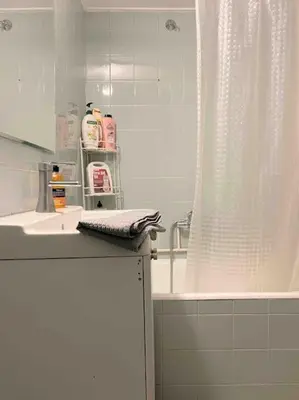 a bathroom with a shower and a sink and a tub at Downtown Athens-Plaka Skoufou Apt/VaccinatedHost in Athens