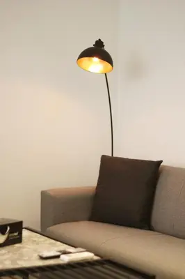 a lamp in a living room next to a couch at K58 Luxury Apartment Monastiraki Metro Station Acropolis Jacuzzi by GK Properties in Athens