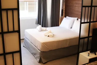 a hotel room with a bed with towels on it at K58 Luxury Apartment Monastiraki Metro Station Acropolis Jacuzzi by GK Properties in Athens